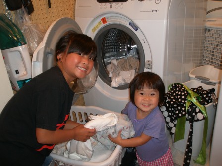 Kasen and Karis helping Mommy with laundry